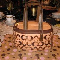 Coach Purse Tan And Brown This was my first time making a purse cake .I made it for my sister who loves Coach purses.She actually thoght I bought her a knock-off...