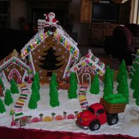 Dscn0705.jpg Santa's Tree Farm...100% edible, aside from the light bulb inside. Poured candy star, tree and trunk. Sculpted rice crispy treats for...