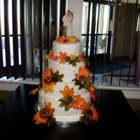 Lisa And James' Wedding Cake Chocolate cake with raspberry filling covered in butter cream. Leaves are silk. I wanted to make them from fondant or chocolate but the...