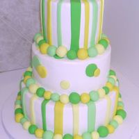 Dots And Stripes Buttercream icing with fondant accents. Hostess of the party added fresh flowers to the top of the cake.