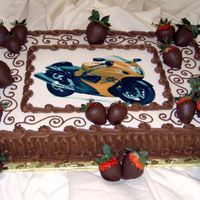 Motorcycle Groom's Cake Chocolate buttercream with dipped strawberries and edible image. The unhappy bride did like the groom's cake!