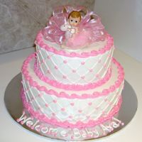 Baby Girl All buttercream with fabric ribbon on top and baby girl figure.