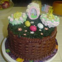 Easter Cake! Yellow cake w/ cookies and cream filling, frosted in choc. bc. All decorations are made by me except for the plastic happy easter sign and...