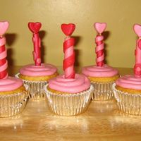 Valentine Cupcake With Heart Candle I made these cupcakes for my kids and their teachers for Valentine's Day. The candles are made out of fondant and brushed with luster...