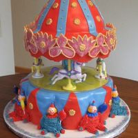 Carousel Cake The birthday girl wanted a carnival themed cake.So this is what I came up with.Peanut Butter cake with peanut butter frosting and PB BC.All...