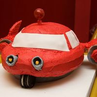 Little Einstein's Rocket Made this for my son's 4th birthday last year. 4 layer chocolate cake, trimmed to shape. Ice cream cone rockets, graham cracker wings...