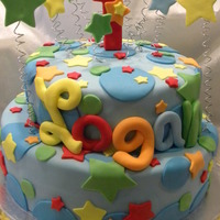 Logan's 1St Birthday This cake was made for a dear friend, who's son turned one. Double tiered cake covered in fondant with fondant accents and wire.