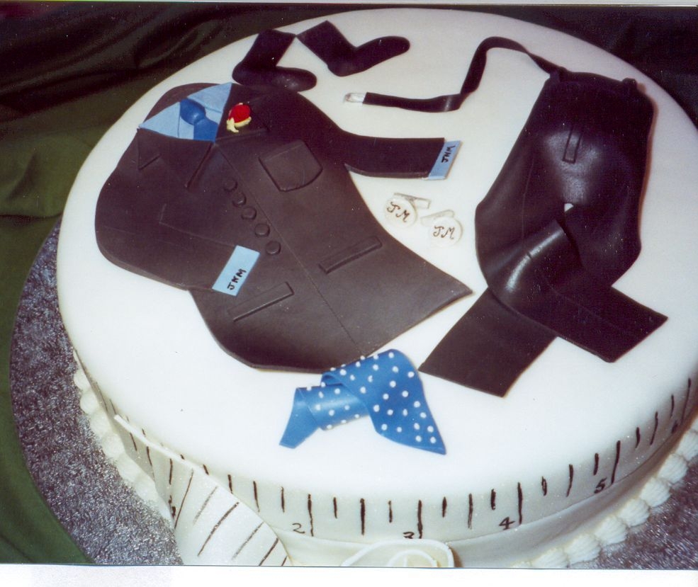 A New Suit For Dad All edible cake representing the Father's Day gift to Dad of a new suit, shirt, socks, belt, tie and cufflinks( monogrammed of course...