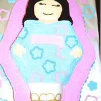 Asian Girl This cake was for a girl's 7th birthday celebrating at a Chinese Restaurant. I used the Wilton doll pan.