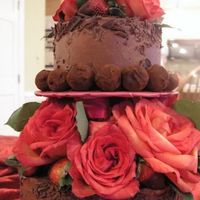 Valentine-Cake-.jpg My first tiered cake! Chocolate cake with chocolate IMBC. Handmade truffles and hand dipped strawberries.