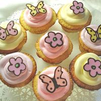 Spring Is In The Air Cupcakes decorated with chocolate butterflies and flowers...