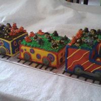 Circus Animal Train This was all done in butter cream frosting - on a day it was 90 degrees with 98% humidity! The animals are a little droopy.