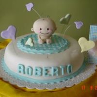 Baby Cake Chocolate Cake with Manjar filling and covered in fondant. Baby and hearts were made in gumpaste.