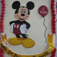 Taytum's Mickey Cake Strawberry cake with vanilla BC. Mickey, ribbon, and balloon are fondant.