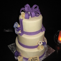 De Maris's Birthday Cake Cake is all red velvet, and all covered in mmf, purple ribbon is wilton fondant. Bow is wilton fondant with tylose, flowers are wilton...