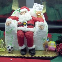 Sleeping Santa Santa sleeping in a chair