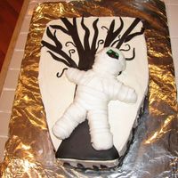 Mummy In The Graveyard 2 layer white cake with Raspberry filling iced in BC. Made this for my daughter's kindergarten Halloween class party 10-31-08, kids...