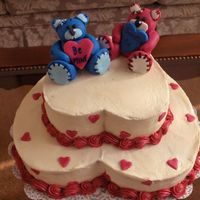 Stitched Up Valentine's Day Bears Bottom is a 10" heart pan n top is an 8" Carrott cake with a vanilla cream cheese filling. Bears are fondant