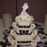 Ivory And Brown Wedding Cake With Calla Lillies 3 tiered Ivory and brown wedding cake my Aunt asked me to make fro her October 25th wedding. Bottom is a 15", middle is a 12" and...