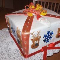 Santa & His Reindeer Gang 4 layer Carrott cake with SPice cream cheese filling, Satin Ice fondant outside also the decorations.. silver dragees and gold luster dust...