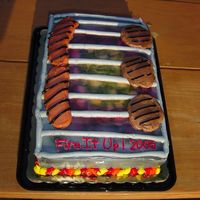 Cook Out! This was a cake I had done in whipped topping. It had beed pitch black with brighter "coals", but whipped topping strikes again...