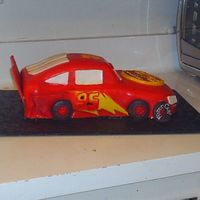 Cars Side View This was my first attempt at a cars cake. I really learned a lot making this one hope it looks ok. I used bc and mmf and royal icing.