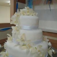 3 Tier Wedding Cake Chocolate cake bottom and middle tier with strawberries between each layer and iced in buttercream Top tier is Gluten Free chocolate cake...