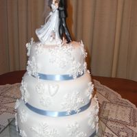 Snowflake Wedding Cake Made for a couple who wanted a winter theme wedding cake. White sour cream cake which is delicious and very easy to work with. Covered in...