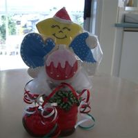 Christmas Cookie Bouquet I made this bouquet for a gift at an office Christmas luncheon. Sugar cookies with royal icing for decorating.