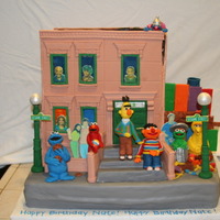 123 Sesame Street I will NEVER.EVER.EVER make a building again. I made the panels two weeks ahead of time with fondant/gumpaste. They must have shrunk or...