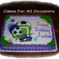 Soccar Request. Soccor edible, buttercream icing accented with sugar flowers.