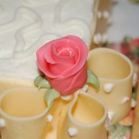 Duff Rose Sheet Cake Border This is a bridal shower cake using white chocolate fondant strips for the ribbon and bow loops going all around the sheet cake. Roses are...