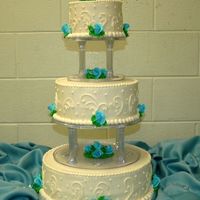 Blue Rose Buds This was my first attempt at working with gumpaste. I made 50 rosebuds for this cake...I finally go tthe hang of it after about 30 of them...