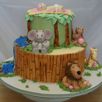 Baby Shower Jungle Cake Buttercream icing with fondant bambo and waterfall. Gum paste animals and baby, chocolate rocks and piping gel for the water. Thank you for...