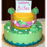 Frog Baby Shower Cake I did this cake to match a baby towel that the couple loved. The cake is covered in buttercream, the frogs and hammock is fondant/gum paste...