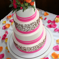 Passion Pink Ribbon Wedding Cake Red velvet cake covered in buttercream, fondant ribbon & piped scroll work. The bride provided the real flower cake topper and rose...