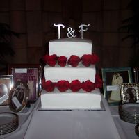 14 The bottom 14" tier was rum cake with rum mousse. The 12" tier was German chocolate cake with coconut/pecan filling. The top tier...