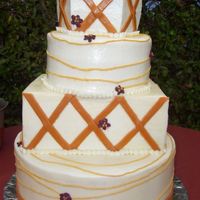 Cristal3.jpg BC frosting with Fondant accents. These were chocolate and white cakes with raspberry fillings. This was my first attempt at using fondant...