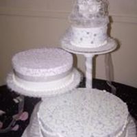 The Bride's Wish... BC icing, White cake, rasp fill TASTED FABULOUS!This was a simple cake to decorate however I felt like it was a little plain. What matters...