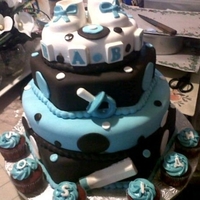 Baby Shower All red velvet creation covered in fondant and filled with cream cheese icing. Accents are fondant and chocolate! Coordinating yellow...