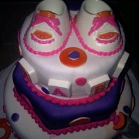 Baby Shower Yellow and Red Velvet cakes. Covered in Fondant and chocolate accents.