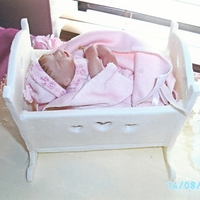 Gumpasete Crib Crib is made of gumpaste, the baby inside of it is not.