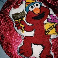 Elmo This was my very 1st cake. Just a chocolate with buttercream on a formed cake pan. Thanks for looking!! :)