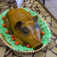 Roasted Pig This was done for a Christmas dinner as a centerpiece. Decorated in fondant.