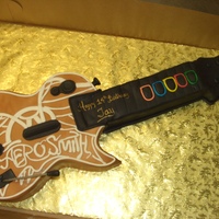 Rockband Guitar All edible. Aerosmith logo done by hand with fondant.