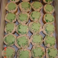 St. Patrick's Day Cupcakes Just plain vanilla cupcakes and store bought icing with royal icing shamrocks.