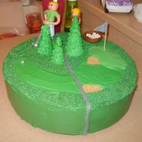 Golf Cake My kids made the figures of my and dad out of fondant