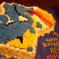 Dragon Made using the wilton Dragon mold. My son requested a blue dragon. I'm not pleased with my fire but everything else turned out well.