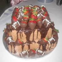 Grooms Cake 2-tier chocolate BC cake w/ganach and decorated with chocolate covered strawberries and football truffles. Thanks for looking!!