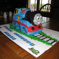 Thomas The Train 3D Cake Made this cake for my son's 2nd birthday. Baked cake in loaf pans and cut to shape. He was so excited to eat Thomas' face!